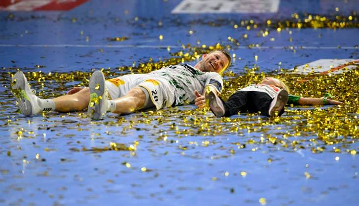 Final jubilation MD, Philipp WEBER MD lies with his little daughter in the gold confetti, Handball Champions League Final Four 2025, Final, Fuechse Berlin B SC Magdeburg MD 26 32, on 15 06 2025 in Cologne Germany Â