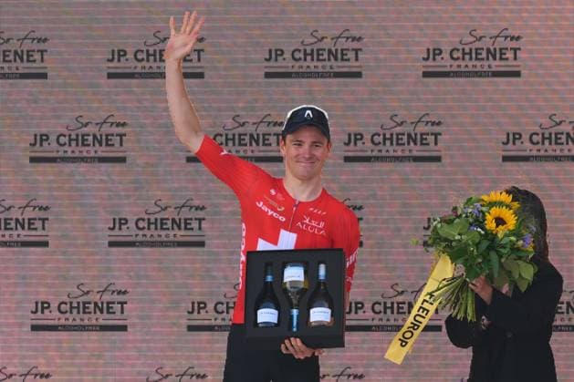 Tour de Suisse 2025 Stage 2 SCHWARZSEE LAC NOIR, SWITZERLAND - JUNE 16 : Schmid Mauro (SUI) of Team Jayco AlUla best Swiss Rider on the podium after stage 2 of the 88th edition of Tour de Suisse an UCI World Tour 2.UWT cycling road race stage for Men Elite of 177 km with start in Aarau and finish in Schwarzsee Lac Noir on June 16, 2025 in Schwarzsee Lac Noir, Switzerland, 16 06 2025 ( Motordriver Kenny Verfaillie - Schwarzsee Lac Noir Switzerland  Copyright: xVincentxKalutx