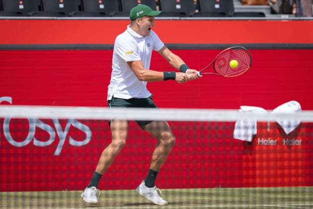 17th June 2025; HSBC Championships, Queens Club, West Kensington, London, England: HSBC Mens Championships Queens Club, Day 2; Jenson Brooksby (USA) plays a backhand shot against Jack Draper (GBR)  ActionPlus12802019 IanxStephen
