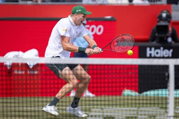 17th June 2025; HSBC Championships, Queens Club, West Kensington, London, England: HSBC Mens Championships Queens Club, Day 2; Jenson Brooksby (USA) plays a backhand shot against Jack Draper (GBR)  ActionPlus12802035 IanxStephen