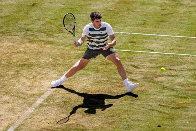 17th June 2025; HSBC Championships, Queens Club, West Kensington, London, England: HSBC Mens Championships Queens Club, Day 2; Adam Walton (AUS) Carlos Alcaraz (ESP) plays a forehand shot against Carlos Alcaraz (ESP)  ActionPlus12802095 IanxStephen