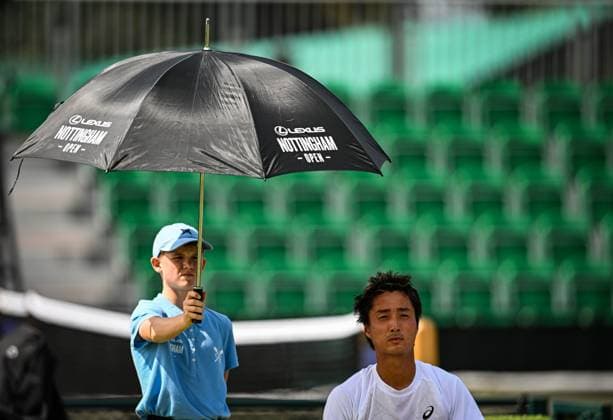 18th June 2025; Lexus Nottingham Tennis Centre, Nottingham, England; Lexus Nottingham Open, Day 3; Shintaro Mochizuki (JPN) is shaded from the intense British sun by a ballboy holding an umbrella  ActionPlus12802211 GodfreyxPitt