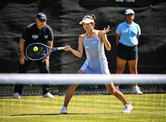 18th June 2025; Lexus Nottingham Tennis Centre, Nottingham, England; Lexus Nottingham Open, Day 3; Ena Shibahara (JPN) world No 59 hits a forehand return in the second round match with her partner Anna Danilina (KAZ) world No 9 against Isabelle Haverlag (NED) world No 97 and Maia Lumsden (GBR) world No 70  ActionPlus12802370 GodfreyxPitt