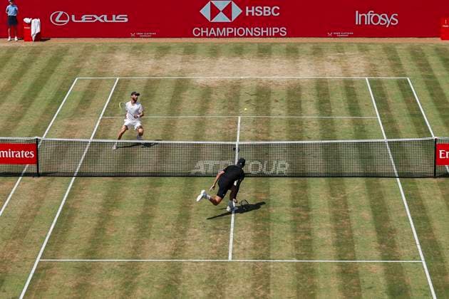 19th June 2025; HSBC Championships, Queens Club, West Kensington, London, England: HSBC Mens Championships Queens Club, Day 4; Corentin Moutet (FRA) and Jacob Fearnley (GBR) close to the net  ActionPlus12802646 HenningxVonxJagow