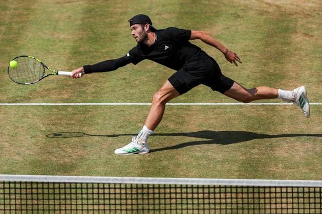 19th June 2025; HSBC Championships, Queens Club, West Kensington, London, England: HSBC Mens Championships Queens Club, Day 4; Jacob Fearnley (GBR) plays a forehand shot against Corentin Moutet (FRA)  ActionPlus12802650 HenningxVonxJagow