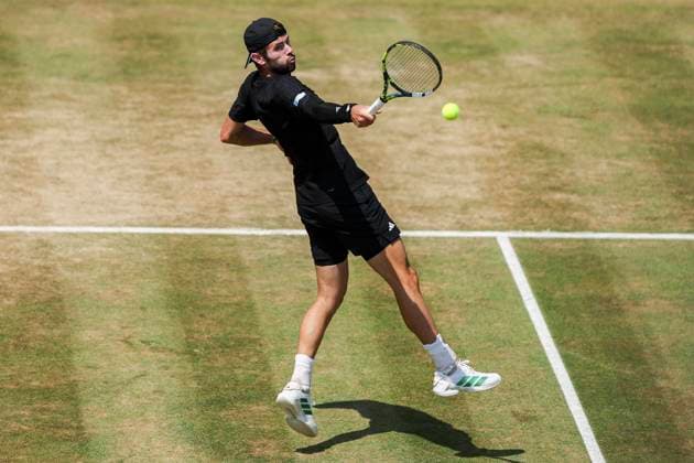 19th June 2025; HSBC Championships, Queens Club, West Kensington, London, England: HSBC Mens Championships Queens Club, Day 4; Jacob Fearnley (GBR) plays a backhand shot against Corentin Moutet (FRA)  ActionPlus12802654 HenningxVonxJagow