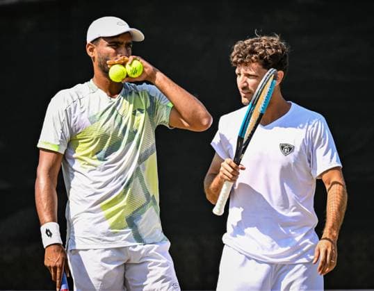 19th June 2025; Lexus Nottingham Tennis Centre, Nottingham, England; Lexus Nottingham Open, Day 4; Rithvik Choudary Bollipalli (IND) discusses tactics in his quarter final match with his partner Nicolas Barrientos (COL) against Diego Hidalgo (ECU) and Patrik Trhac (USA)  ActionPlus12802724 GodfreyxPitt
