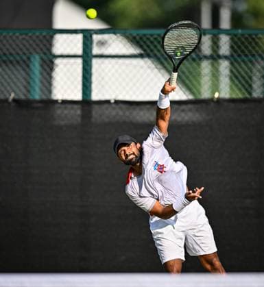 19th June 2025; Lexus Nottingham Tennis Centre, Nottingham, England; Lexus Nottingham Open, Day 4; Jeevan Nedunchezhiyan (IND) serves in his quarter final match with his partner Jaime Faria (POR) against Austin Krajicek (USA) and Santiago Gonzalez (MEX)  ActionPlus12802827 GodfreyxPitt