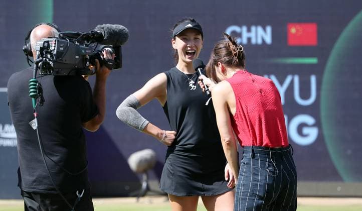 Wang Xinyu CHN laughs in interview after victory against Lyudmila Samsonova RUS at Steffi Graf Stadium Sport Semifinal HYLO Berlin Tennis Open Women on grass 21 06 2025
