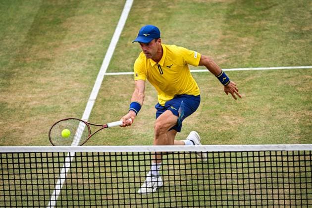 21st June 2025; HSBC Championships, Queens Club, West Kensington, London, England: HSBC Mens Championships Queens Club, Day 6; Roberto Bautista Agut (ESP) hits a volley at the net in his semi final match against Carlos Alcaraz (ESP)  ActionPlus12803828 GodfreyxPitt