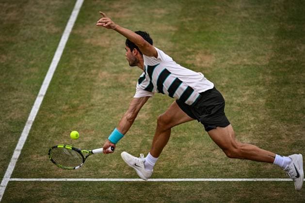 21st June 2025; HSBC Championships, Queens Club, West Kensington, London, England: HSBC Mens Championships Queens Club, Day 6; Carlos Alcaraz (ESP) hits a backhand in his semi final match against Roberto Bautista Agut (ESP)  ActionPlus12803832 GodfreyxPitt