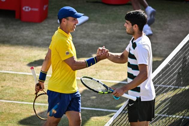 21st June 2025; HSBC Championships, Queens Club, West Kensington, London, England: HSBC Mens Championships Queens Club, Day 6; Roberto Bautista Agut (ESP) congratulates countryman Carlos Alcaraz (ESP) on his victory 6-4 6-4  ActionPlus12803852 GodfreyxPitt