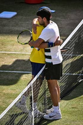 21st June 2025; HSBC Championships, Queens Club, West Kensington, London, England: HSBC Mens Championships Queens Club, Day 6; Roberto Bautista Agut (ESP) embraces and congratulates countryman Carlos Alcaraz (ESP) on his victory 6-4 6-4  ActionPlus12803853 GodfreyxPitt