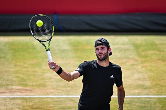 21st June 2025; HSBC Championships, Queens Club, West Kensington, London, England: HSBC Mens Championships Queens Club, Day 6; Jacob Fearnley (GBR) hits a volley in his semi final match with his partner Cameron Norrie (GBR) against Nikola Mektic (CRO) and Michael Venus (NZL)  ActionPlus12803877 GodfreyxPitt