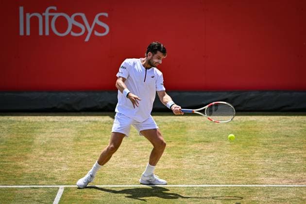 21st June 2025; HSBC Championships, Queens Club, West Kensington, London, England: HSBC Mens Championships Queens Club, Day 6; Cameron Norrie (GBR) hits a forehand in his semi final match with his partner Jacob Fearnley (GBR) against Nikola Mektic (CRO) and Michael Venus (NZL)  ActionPlus12803880 GodfreyxPitt
