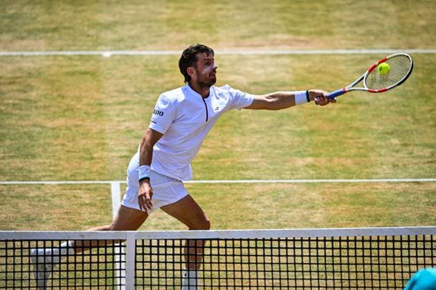 21st June 2025; HSBC Championships, Queens Club, West Kensington, London, England: HSBC Mens Championships Queens Club, Day 6; Cameron Norrie (GBR) hits a volley in his semi final match with his partner Jacob Fearnley (GBR) against Nikola Mektic (CRO) and Michael Venus (NZL)  ActionPlus12803883 GodfreyxPitt