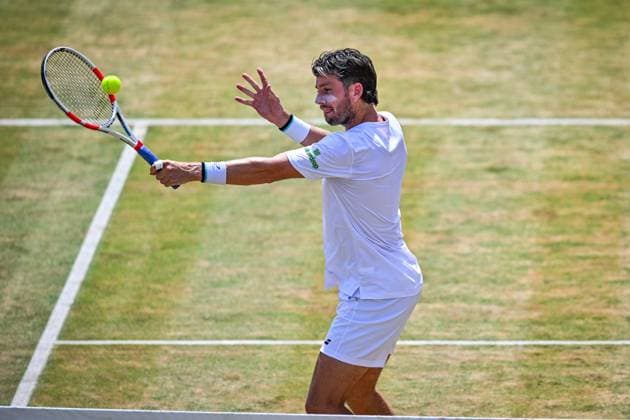 21st June 2025; HSBC Championships, Queens Club, West Kensington, London, England: HSBC Mens Championships Queens Club, Day 6; Cameron Norrie (GBR) hits a volley in his semi final match with his partner Jacob Fearnley (GBR) against Nikola Mektic (CRO) and Michael Venus (NZL)  ActionPlus12803898 GodfreyxPitt