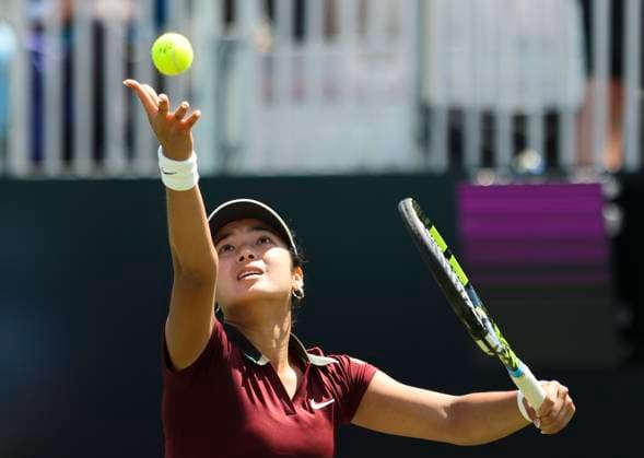 22nd June 2025; Devonshire Park, Eastbourne, East Sussex, England: Lexus International Eastbourne, Qualifying Day 2; Alexandra Eala (PHI) serves to Hailey Baptiste (USA)  ActionPlus12804214 HongboxChen
