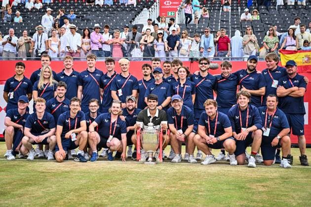 22nd June 2025; HSBC Championships, Queens Club, West Kensington, London, England: HSBC Mens Championships Queens Club, Day 7; Carlos Alcaraz (ESP) celebrates winning the final against Jiri Lehecka (CZE) and poses with the trophy with the groundstaff  ActionPlus12804264 GodfreyxPitt