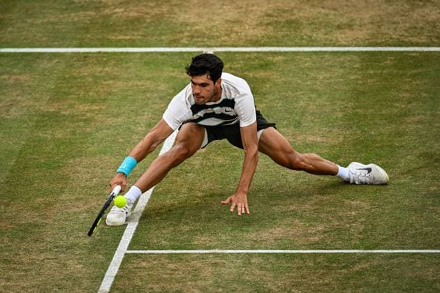 22nd June 2025; HSBC Championships, Queens Club, West Kensington, London, England: HSBC Mens Championships Queens Club, Day 7; Carlos Alcaraz (ESP) slides and hits a volley in the final against Jiri Lehecka (CZE)  ActionPlus12804250 GodfreyxPitt