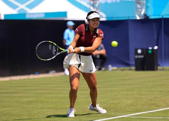 22nd June 2025; Devonshire Park, Eastbourne, East Sussex, England: Lexus International Eastbourne, Qualifying Day 2; Alexandra Eala (PHI) plays a backhand shot against Hailey Baptiste (USA)  ActionPlus12804311 HongboxChen