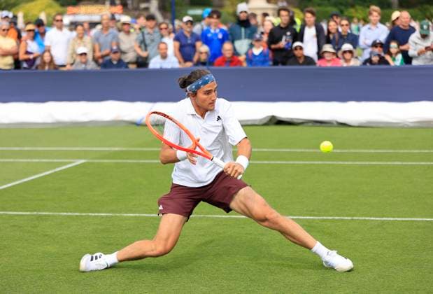 22nd June 2025; Devonshire Park, Eastbourne, East Sussex, England: Lexus International Eastbourne, Qualifying Day 2; Mattia Bellucci (ITA) plays a backhand shot against Chun-Hsin Tseng (TPE)  ActionPlus12804336 HongboxChen