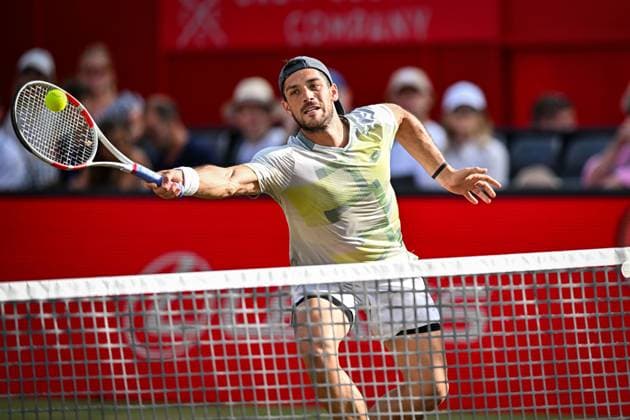 22nd June 2025; HSBC Championships, Queens Club, West Kensington, London, England: HSBC Mens Championships Queens Club, Day 7; Julian Cash (GBR) hits a volley in the mens doubles final match with his partner Lloyd Glasspool (GBR) against Nikola Mektic (CRO) and Michael Venus (NZL)  ActionPlus12804562 GodfreyxPitt