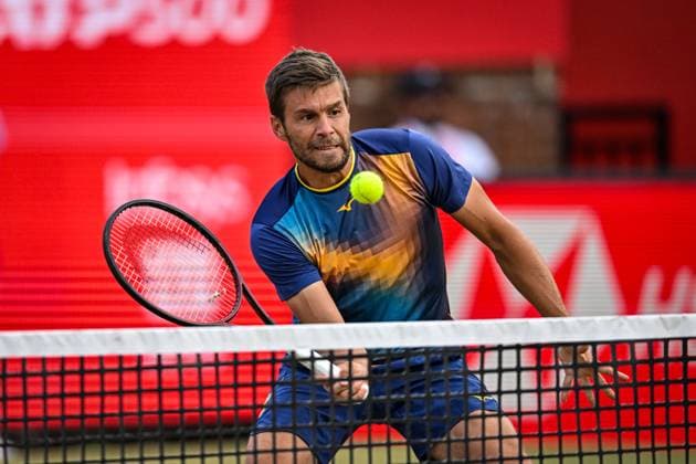 22nd June 2025; HSBC Championships, Queens Club, West Kensington, London, England: HSBC Mens Championships Queens Club, Day 7; Nikola Mektic (CRO) hits a volley in the mens doubles final match with the partner Michael Venus (NZL) against Julian Cash (GBR) and Lloyd Glasspool (GBR)  ActionPlus12804566 GodfreyxPitt