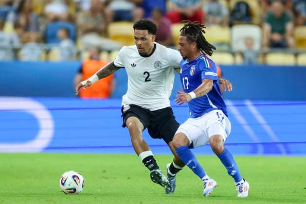 Nnamdi Collins Germany and Luca Koleosho Italy battle for the ball, UEFA European Under 21 Championship 2025 Quarter Final, Germany v Italy, MOL ArÃ na on June 22, 2025 in Dunajska Streda, Slovakia Photo by Marco Steinbrenner DeFodi Images Nnamdi Collins Germany and Luca Koleosho Italy battle for the ball, UEFA European Under 21 Championship 2025 Quarter Final, Germany v Italy, MOL ArÃ na, June 22, 2025 in Dunajska Streda, Slovakia Photo by Marco Steinbrenner DeFodi Images