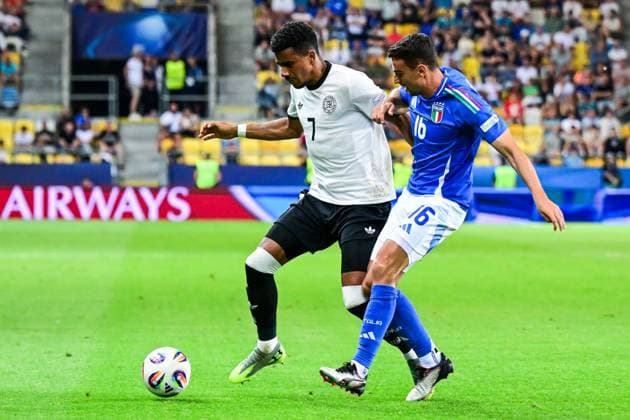 DUNAJSKA STREDA - (l-r) Ansgar Knauff of Germany U21, U 21 Riccardo Turicchia of Italy U21 at the DAC Arena during the quarterfinal European Under-21 Championship game between Germany and Italy. ANP Hollandse Hoogte SOC 2025 xVIxANPxSportx xGerritxvanxKeulenxIVx 530325325 originalFilename: 530325325.jpg