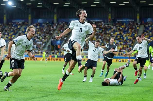 Merlin Roehl Germany celebrates after scoring his teams 3 2 goal, UEFA European Under 21 Championship 2025 Quarter Final, Germany v Italy, MOL ArÃ na, June 22, 2025 in Dunajska Streda, Slovakia Photo by Marco Steinbrenner DeFodi Images Merlin Roehl Germany celebrates after scoring his teams third goal, UEFA European Under 21 Championship 2025 Quarter Final, Germany v Italy, MOL ArÃ na, June 22, 2025 in Dunajska Streda, Slovakia Photo by Marco Steinbrenner DeFodi Images
