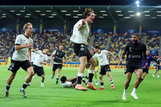 Merlin Roehl Germany celebrates after scoring his teams 3 2 goal, UEFA European Under 21 Championship 2025 Quarter Final, Germany v Italy, MOL ArÃ na, June 22, 2025 in Dunajska Streda, Slovakia Photo by Marco Steinbrenner DeFodi Images Merlin Roehl Germany celebrates after scoring his teams third goal, UEFA European Under 21 Championship 2025 Quarter Final, Germany v Italy, MOL ArÃ na, June 22, 2025 in Dunajska Streda, Slovakia Photo by Marco Steinbrenner DeFodi Images