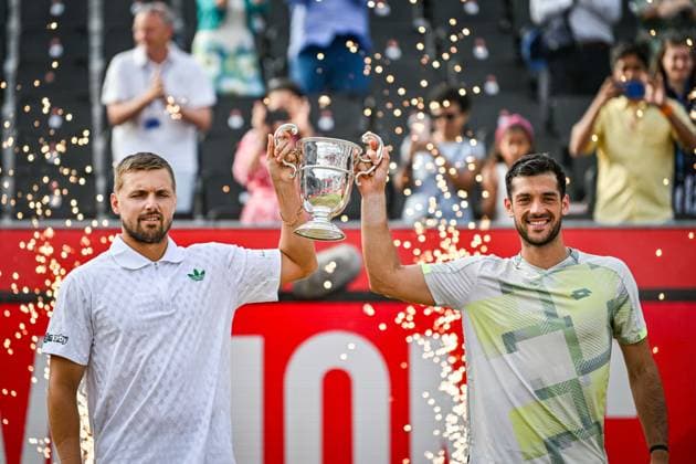22nd June 2025; HSBC Championships, Queens Club, West Kensington, London, England: HSBC Mens Championships Queens Club, Day 7; Lloyd Glasspool (GBR) holds the trophy after winning the mens doubles final match with partner Julian Cash (GBR) against Nikola Mektic (CRO) and Michael Venus (NZL)  ActionPlus12804570 GodfreyxPitt