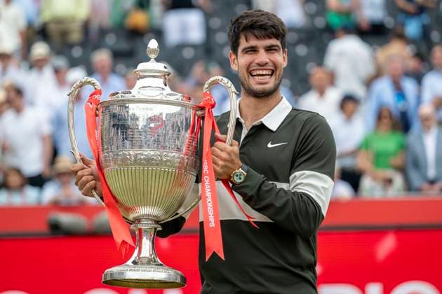 (250623) -- LONDON, June 23, 2025 -- Carlos Alcaraz celebrates with the trophy during the awarding ceremony for the men s singles final between Carlos Alcaraz of Spain and Jiri Lehecka of the Czech Republic at the Queen s Club Championships in London, Britain, on June 22, 2025. (Photo by Xinhua) (SP)BRITAIN-LONDON-TENNIS-QUEEN S CLUB CHAMPIONSHIPS-MEN S SINGLES-FINAL StephenxChung 