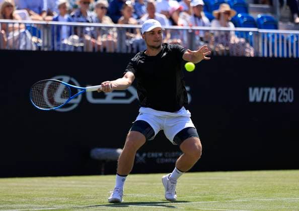 23rd June 2025; Devonshire Park, Eastbourne, East Sussex, England; Lexus International Eastbourne, Day 1; Miomir Kecmanovic (SRB) plays a forehand shot against Daniel Evans (GBR)  ActionPlus12804763 HongboxChen