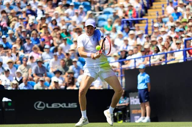 23rd June 2025; Devonshire Park, Eastbourne, East Sussex, England; Lexus International Eastbourne, Day 1; Joao Fonseca (BRA) plays a backhand shot against Zizou Bergs (BEL)  ActionPlus12804747 HongboxChen