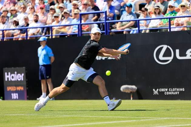 23rd June 2025; Devonshire Park, Eastbourne, East Sussex, England; Lexus International Eastbourne, Day 1; Miomir Kecmanovic (SRB) plays a backhand shot against Daniel Evans (GBR)  ActionPlus12804776 HongboxChen