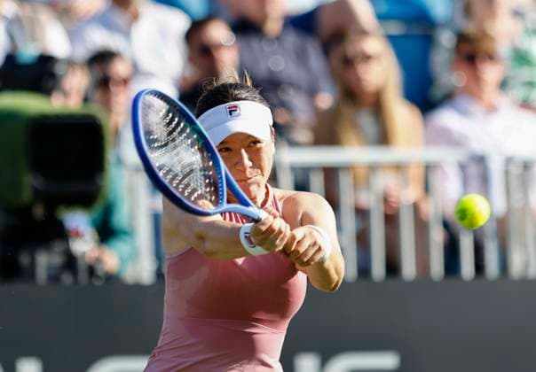 23rd June 2025; Devonshire Park, Eastbourne, East Sussex, England; Lexus International Eastbourne, Day 1; Lulu Sun (NZL) plays a backhand shot against Daria Kasatkina (AUS)  ActionPlus12804858 HongboxChen