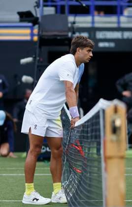 24th June 2025; Devonshire Park, Eastbourne, East Sussex, England; Lexus International Eastbourne, Day 2; Flavio Cobolli (ITA) checks Jacob Fearnley (GBR) after he slips  ActionPlus12805264 HongboxChen
