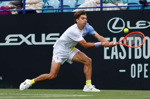 24th June 2025; Devonshire Park, Eastbourne, East Sussex, England; Lexus International Eastbourne, Day 2; Flavio Cobolli (ITA) plays a backhand shot against Jacob Fearnley (GBR)  ActionPlus12805267 HongboxChen
