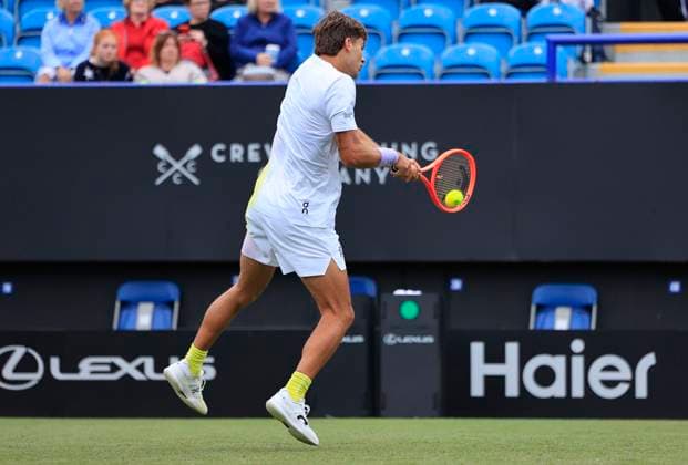 24th June 2025; Devonshire Park, Eastbourne, East Sussex, England; Lexus International Eastbourne, Day 2; Flavio Cobolli (ITA) plays a backhand shot against Jacob Fearnley (GBR)  ActionPlus12805317 HongboxChen