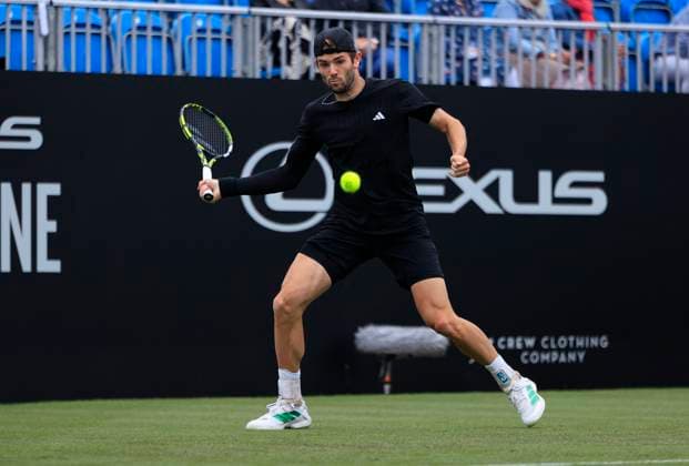 24th June 2025; Devonshire Park, Eastbourne, East Sussex, England; Lexus International Eastbourne, Day 2; Jacob Fearnley (GBR) plays a forehand shot against Flavio Cobolli (ITA)  ActionPlus12805319 HongboxChen