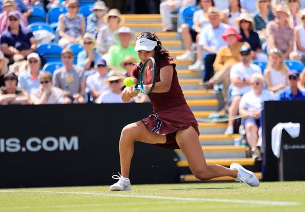 25th June 2025; Devonshire Park, Eastbourne, East Sussex, England; Lexus International Eastbourne, Day 3; Emma Raducanu (GBR) plays a backhand shot against Maya Joint (AUS)  ActionPlus12805392 HongboxChen