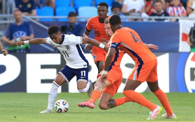 Omari Hutchinson of England Under 21 is tackled by Luciano Valente of Netherlands U21, U 21 England U21 v Netherlands U21, UEFA U21 Championship, Semi-Final, National Football Stadium, Bratislava, Slovakia - 25 Jun 2025Bratislava National Football Stadium Slovakia  Copyright: xNikolaxKrstic Shutterstockx 15373680bq