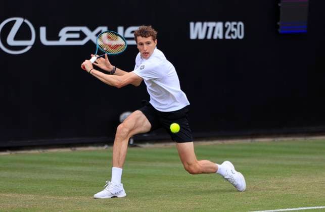 26th June 2025; Devonshire Park, Eastbourne, East Sussex, England; Lexus International Eastbourne, Day 4; Ugo Humbert (FRA) plays a backhand shot against Billy Harris (GBR)  ActionPlus12805518 HongboxChen