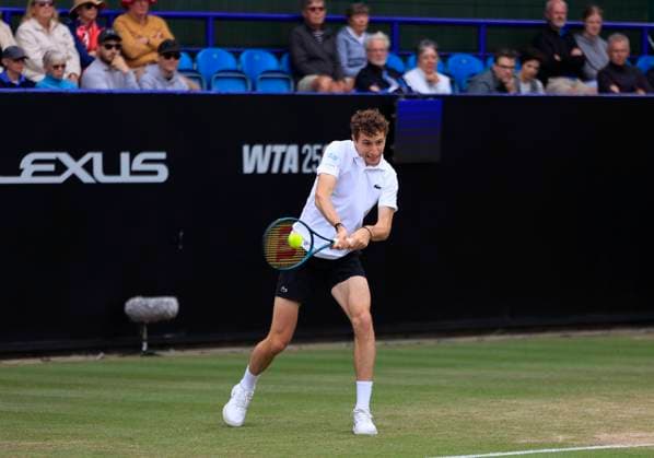 26th June 2025; Devonshire Park, Eastbourne, East Sussex, England; Lexus International Eastbourne, Day 4; Ugo Humbert (FRA) plays a backhand shot against Billy Harris (GBR)  ActionPlus12805521 HongboxChen