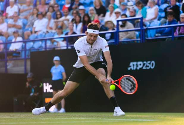 25th June 2025; Devonshire Park, Eastbourne, East Sussex, England; Lexus International Eastbourne, Day 3; Taylor Fritz (USA) plays a backhand shot against Joao Fonseca (BRA)  ActionPlus12805562 HongboxChen