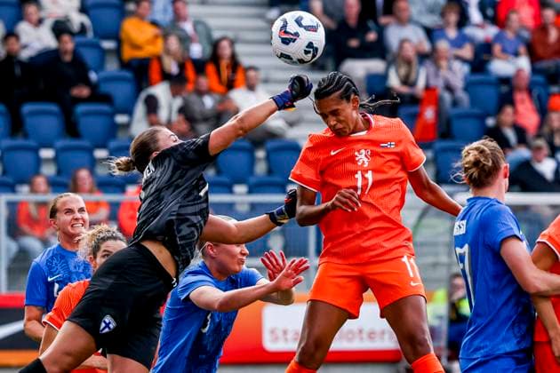 Esmee Brugts of the Netherlands heads the ball and goalkeeper Anna Koivunen of Finland Netherlands v Finland, , Netherlands v Finland, Kooi Stadion, June 26, 2025, Leeuwarden, Netherlands.
