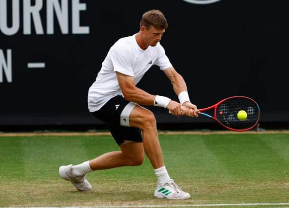 26th June 2025; Devonshire Park, Eastbourne, East Sussex, England; Lexus International Eastbourne, Day 4; Billy Harris (GBR) plays a backhand shot against Ugo Humbert (FRA)  ActionPlus12805703 HongboxChen