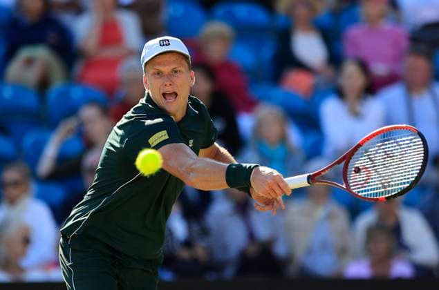 27th June 2025; Devonshire Park, Eastbourne, East Sussex, England; Lexus International Eastbourne, Day 5; Jensen Brooksby (USA) plays a backhand shot against Ugo Humbert (FRA) in the mens semi-finals match  ActionPlus12805985 HongboxChen
